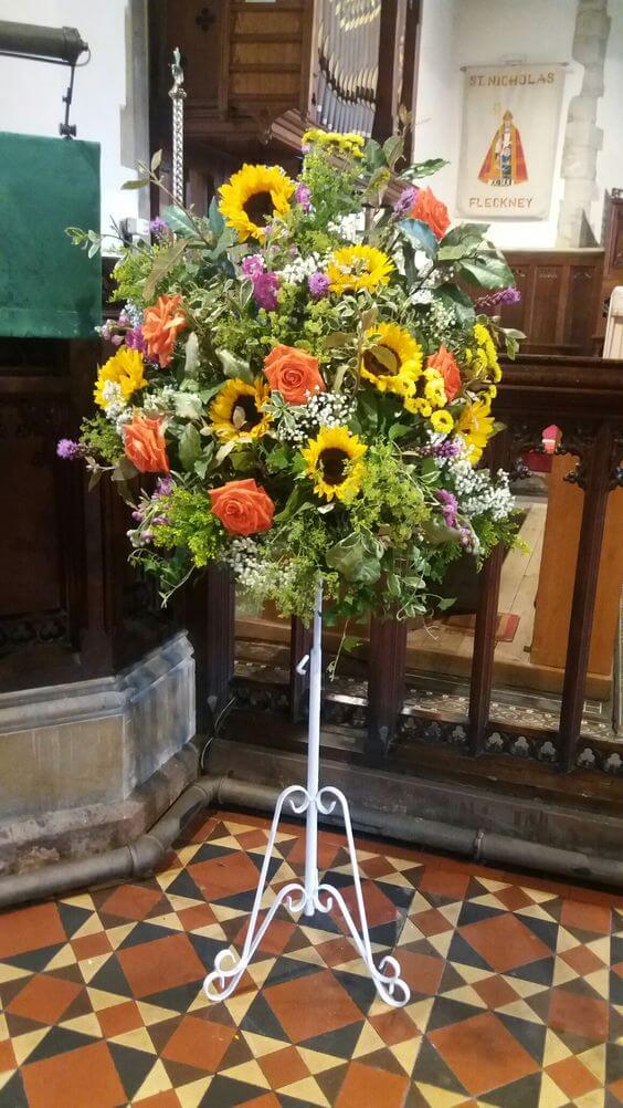 Pedestal with sunflowers for church wedding